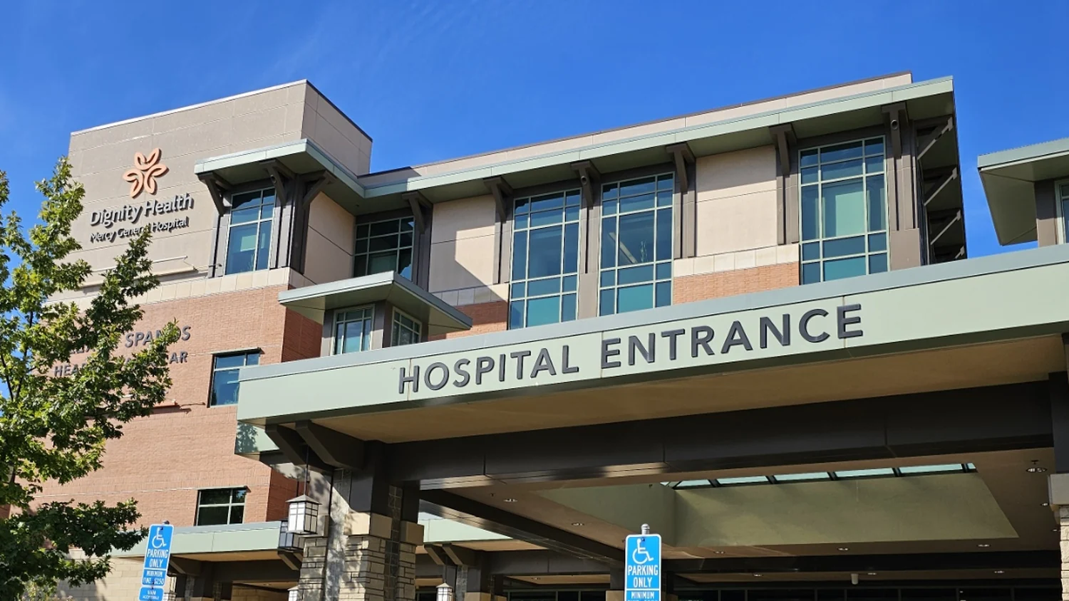 The green HOSPITAL ENTRANCE canopy at Mercy General Hospital in East Sacramento, with the Dignity Health Mercy General Hospital sign on the tower above it
