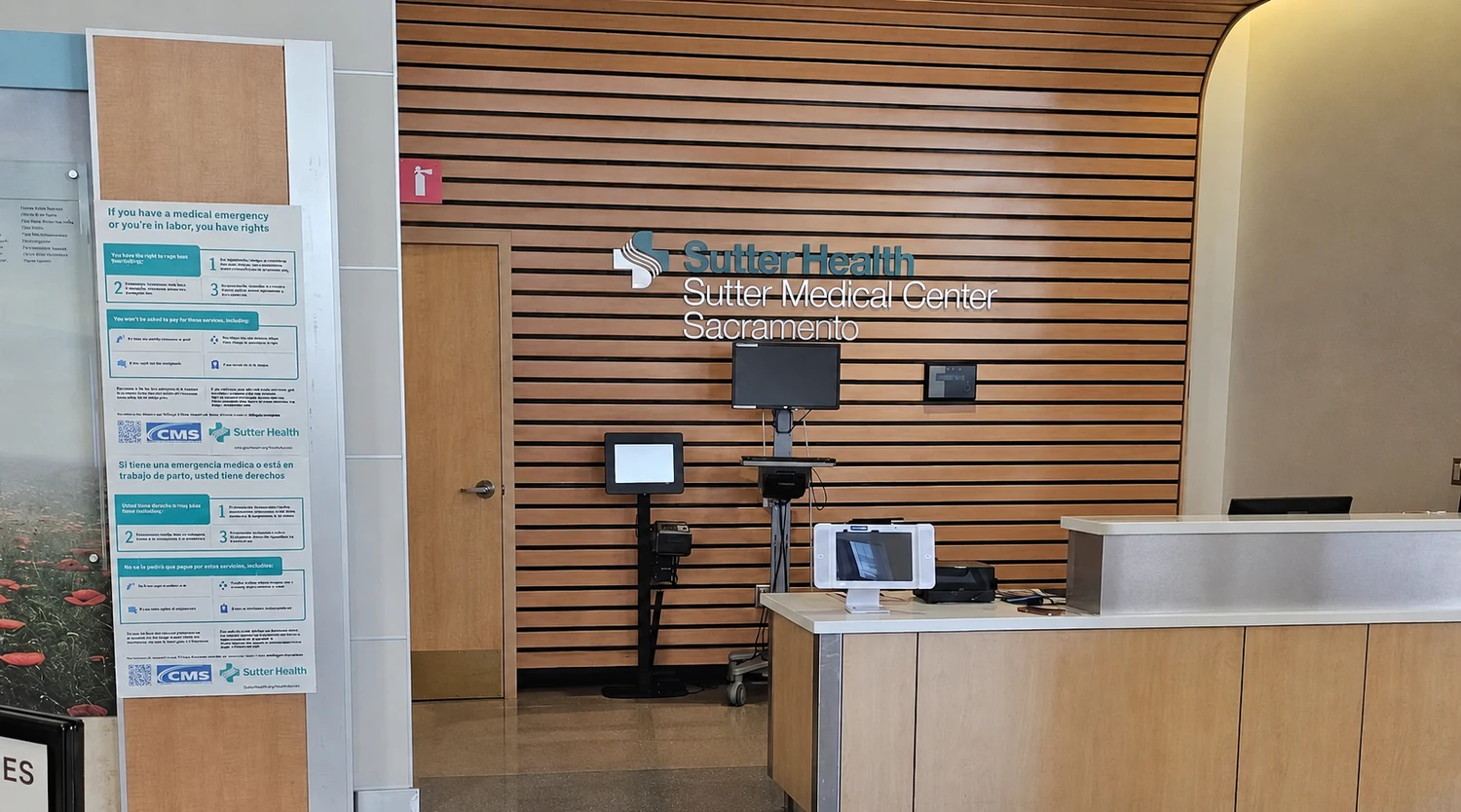 The main lobby check-in desk at Sutter Medical Center Sacramento on Capitol Avenue, where visitors arrive before heading up to a patient room